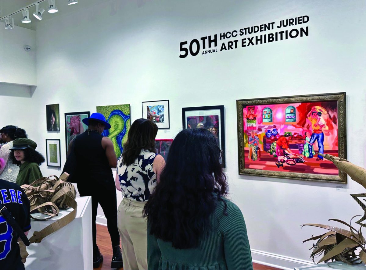 Gallery114 was packed with art enthusiasts for the juried art exhibition on April 11.